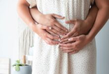 couple touching its belly