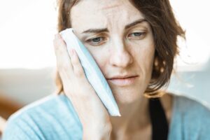 woman treating his headache
