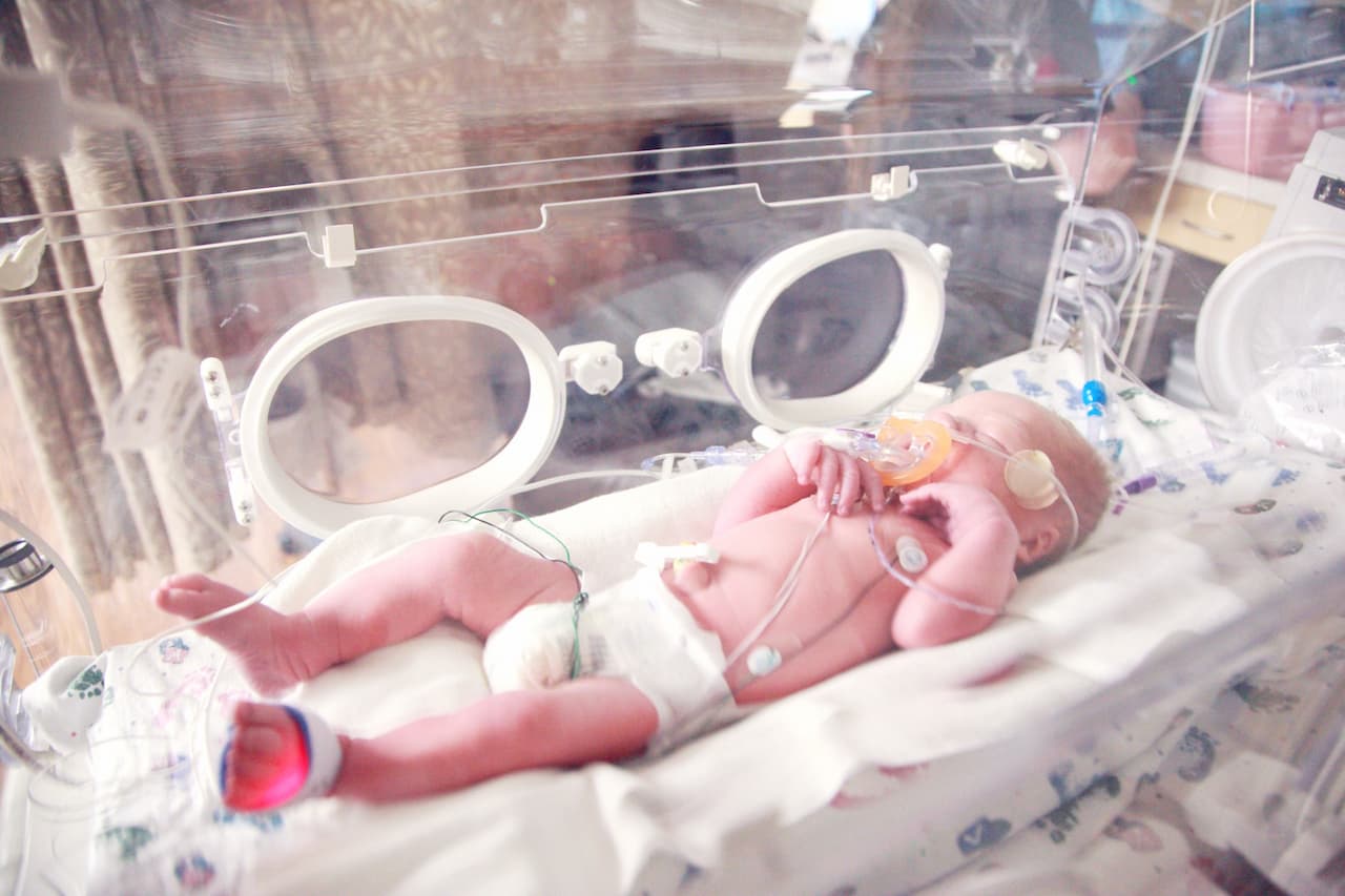 premature baby on the incubator with oxygen on its mouth